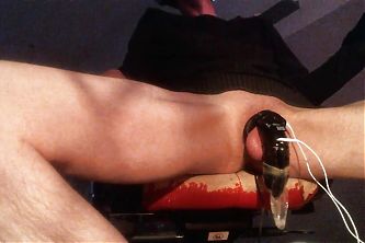 Cumming in chastity with E-stim